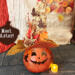 A fall pumpkin made from a dried gourd wearing a fancy custom made witch hat. Her name is Aster.